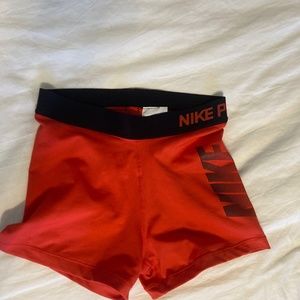 Red Nike pro shorts